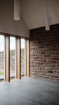 Foto: Julie Lorang, PUR+ Architekten Stein Hemmes Partner GmbB, Kasel Ausblick Friedhofsmauer